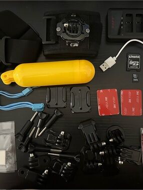 GoPro Hero 7 Black with accessories, extra batteries, 4gb memory card, and case